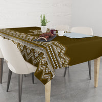Wood-brown tablecloth with cream chevron edge pattern on a dining table
