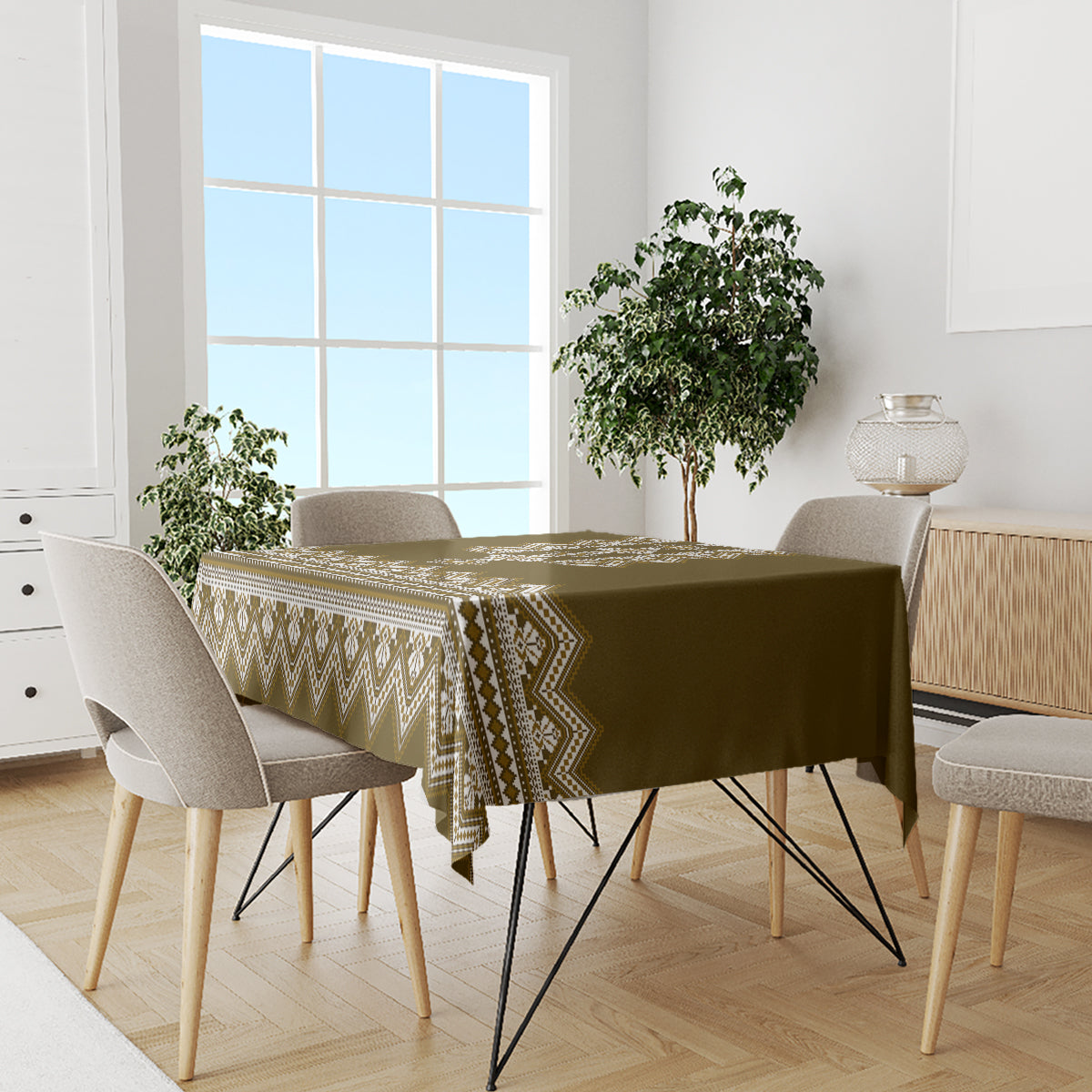 Wood-brown patterned tablecloth with cream zigzag border on a dining table