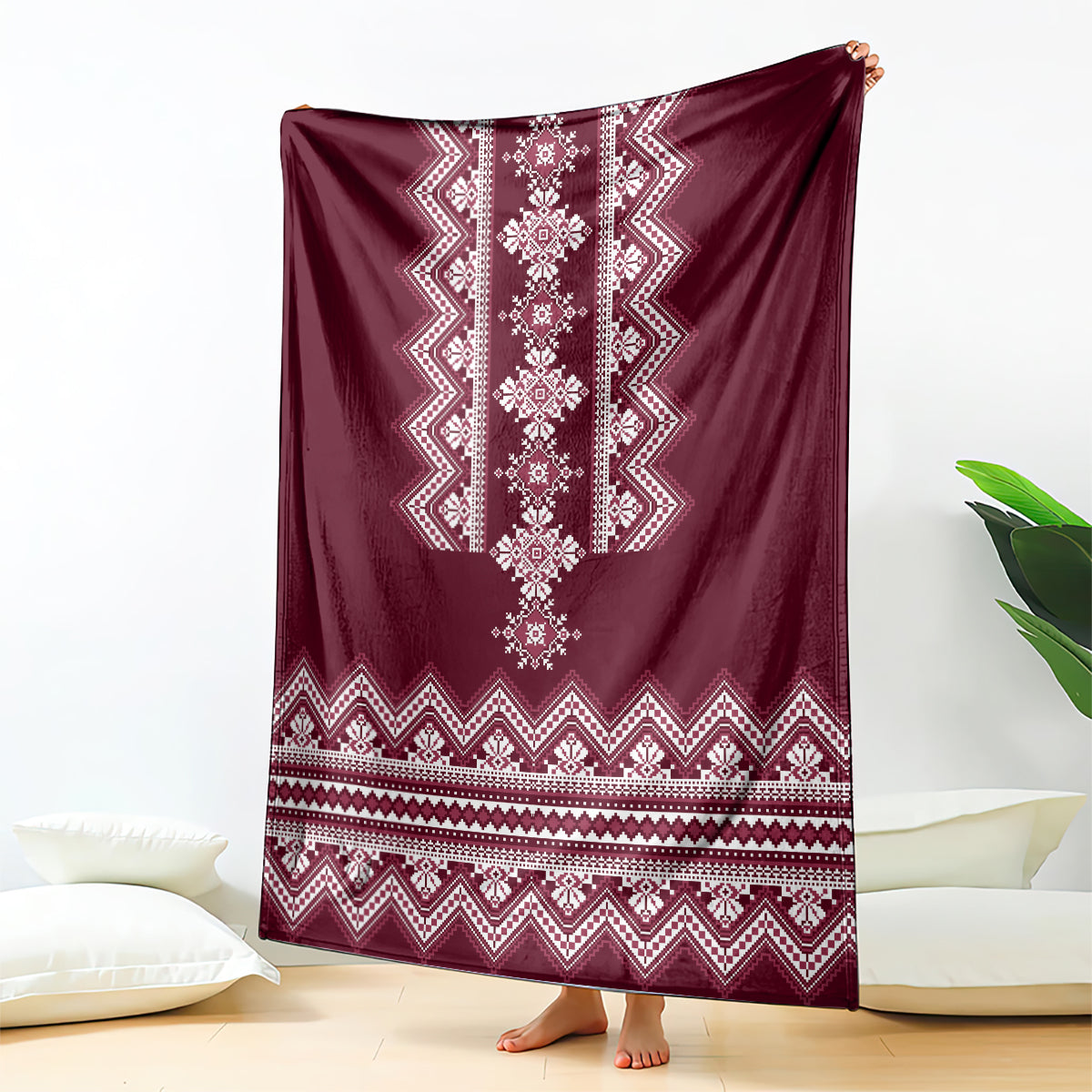 Wine red folk pattern blanket with white geometric diamond center and border