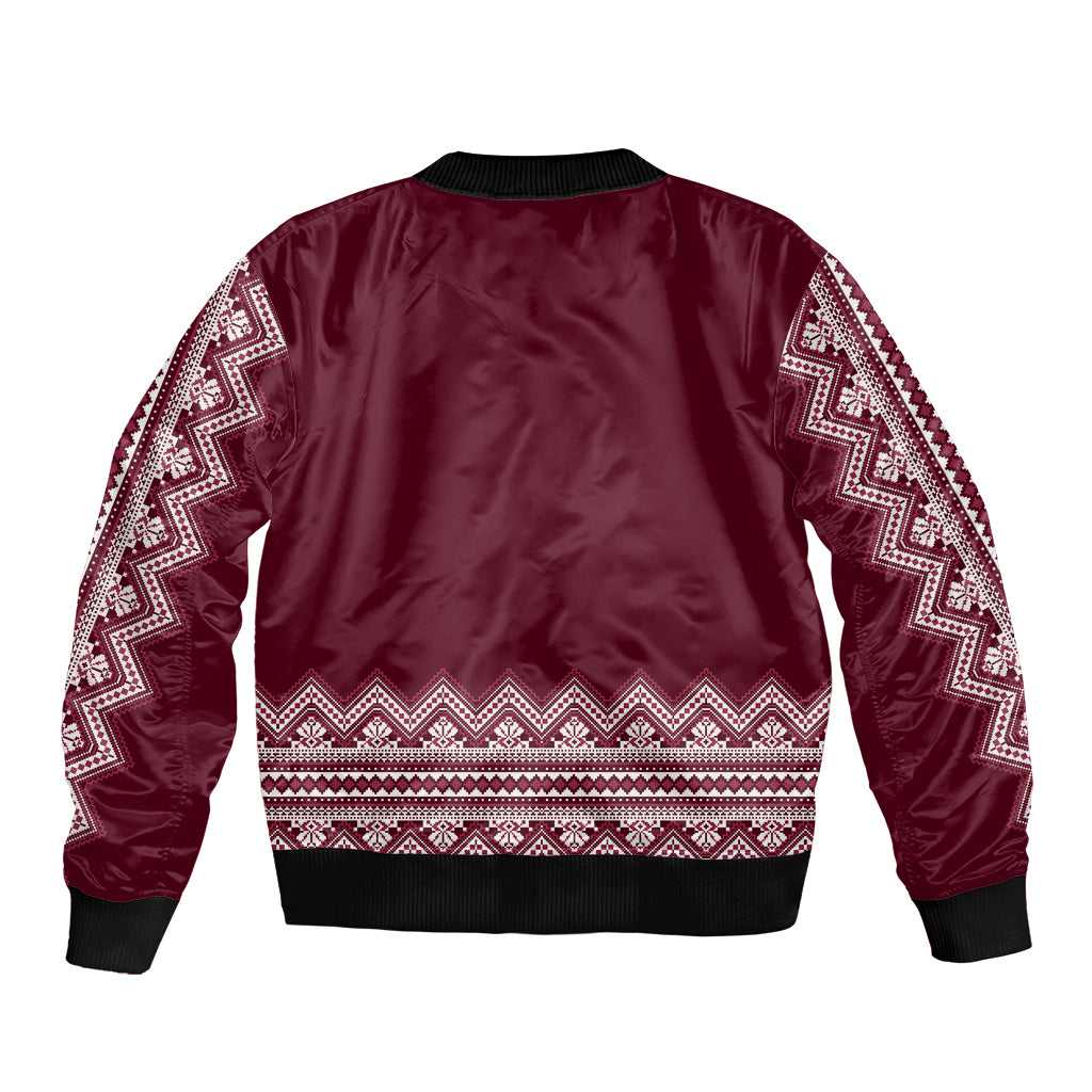 Burgundy bomber jacket back with folk stripe pattern and ribbed hem, no front view