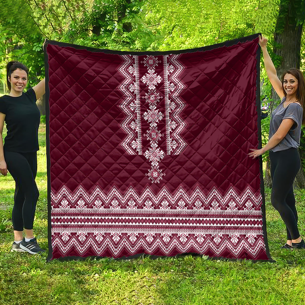 Wine red folk pattern quilt with quilted diamonds and zigzag border stripe