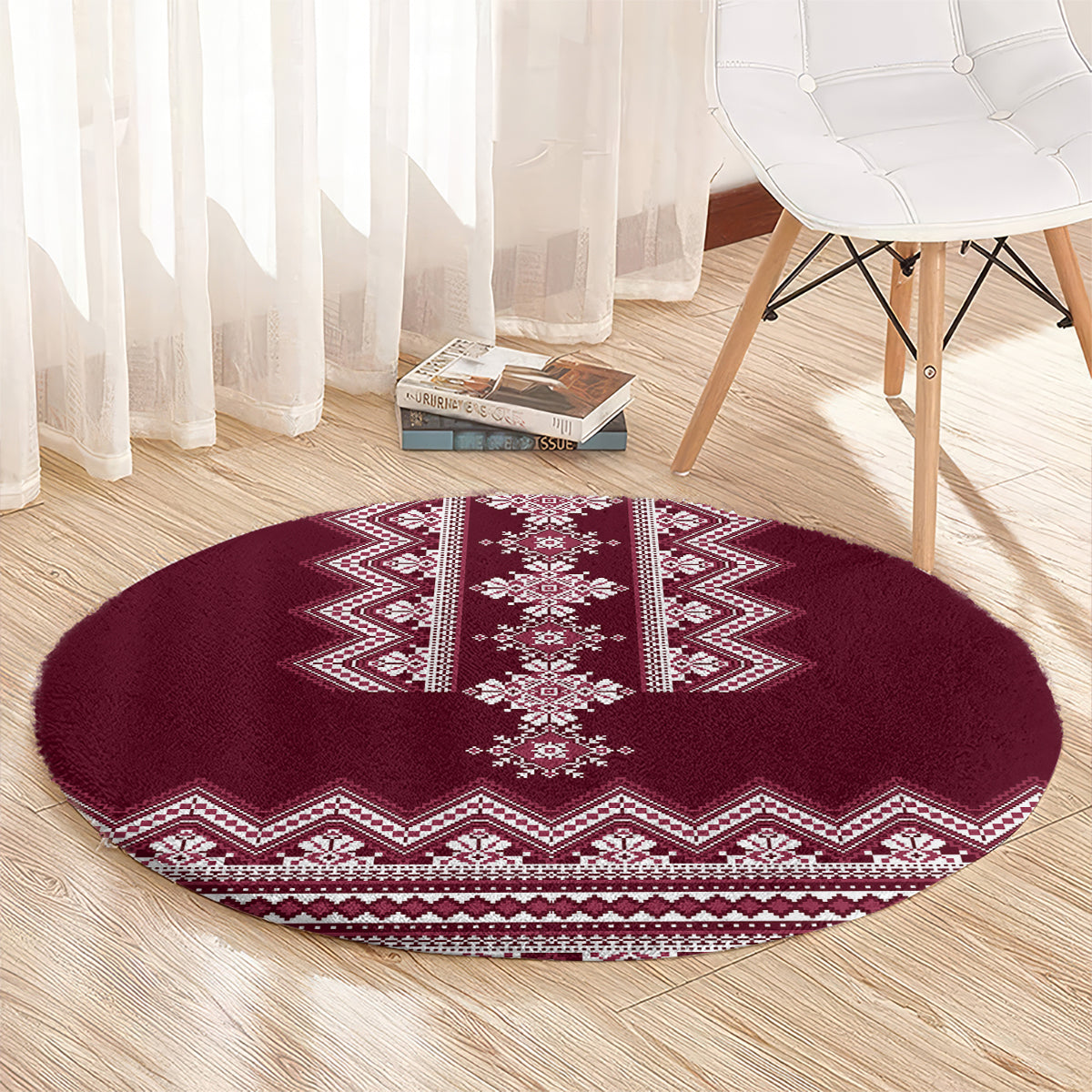Wine red round rug with white central motif and zigzag chevron edge