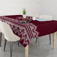 Wine red tablecloth with white Ukrainian folk pattern, zigzag hem and draped corner
