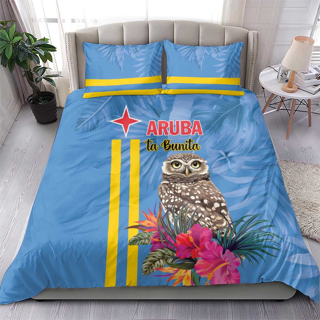 Blue duvet and two pillowcases with tropical owl, pink flowers, and yellow stripe design.