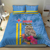 Blue duvet with matching pillowcases, tropical owl and pink blooms, plus yellow stripe bands.