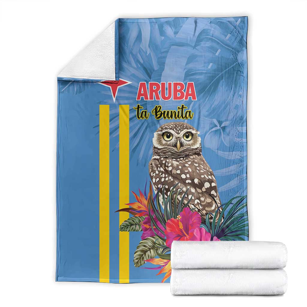 Blue Aruba blanket with owl and tropical floral print; includes folded white towels