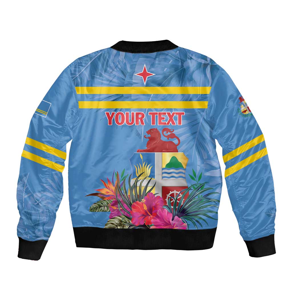 Blue bomber jacket with tropical plants, rooster graphic, black ribbed collar and cuffs.