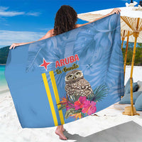 Blue tropical sarong with Aruba La Bonita text, owl and flowers print