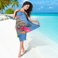 Blue tropical sarong wrap featuring owl, pink hibiscus flowers, and Aruba La Bonita