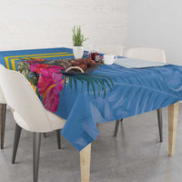 Blue tablecloth with yellow stripes and large pink floral leaves