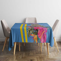 Blue tablecloth with yellow stripes and colorful tropical floral center panel