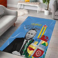 Blue area rug with man portrait and “Betico” text over Aruba flag design