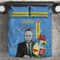 Blue bedding set showing portrait, laurel wreath, and flag emblem on duvet with two pillows