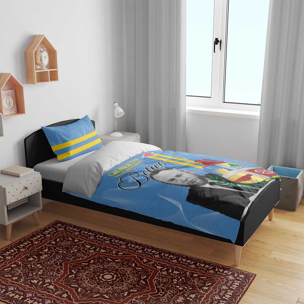 Blue printed duvet with portrait and flag emblem; two matching pillows with yellow stripes