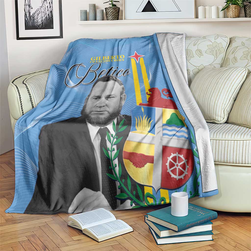 Blue Aruba flag style blanket with printed portrait, star, and Betico lettering, draped