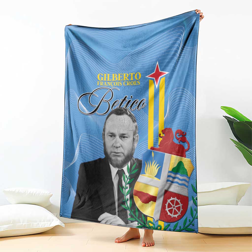 Blue Aruba flag style blanket with portrait print and Betico logo, draped over floor