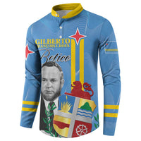 Blue long-sleeve button sweatshirt with yellow collar and colorful flag panel graphic
