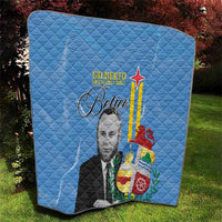 Blue quilt blanket on grass, quilted texture with portrait and Aruba-style flag graphic