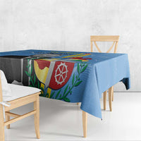 Blue Aruba flag-style tablecloth with crest print on dining table