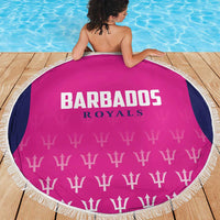 Pink round beach blanket showing Barbados Royals logo and white fringe border