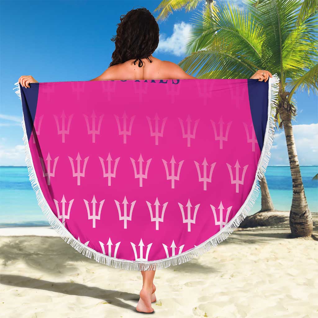 Pink circular beach blanket with trophy pattern on back and white fringe border