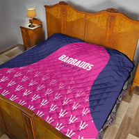 Navy and pink quilt blanket with “Barbados Royals” logo, diamond quilt texture, trophy print.