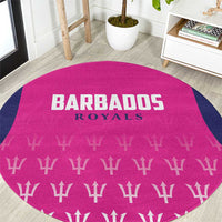 Pink round cricket carpet close-up: Barbados Royals text, trophy pattern, navy border
