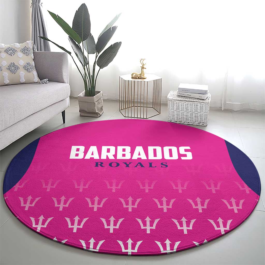 Pink round cricket carpet with Barbados Royals text and trophy pattern, navy accents on floor