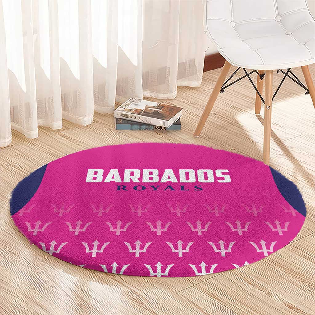 Pink round cricket carpet with Barbados Royals branding, trophy symbols, and navy side panel