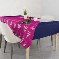 Pink tablecloth with white bat pattern and navy draped corner on dining table