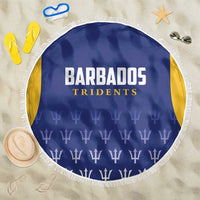 Round blue beach blanket with Barbados Tridents lettering, trophy pattern, white fringe