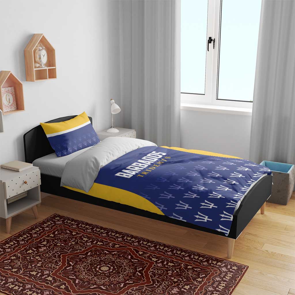 Barbados Tridents cricket bedding set on bed: blue duvet with yellow trim and logo