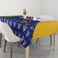Barbados Tridents tablecloth on rectangular table, blue with white trident pattern and yellow side