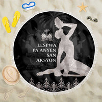 Round black beach blanket with white silhouette graphic and decorative fringe edge