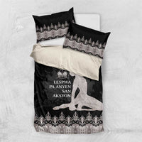 Bedding set on white surface: black duvet cover with silver border and two pillowcases
