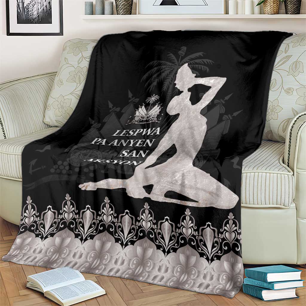Black and silver throw blanket with white silhouette, palm motif, and ornate trim