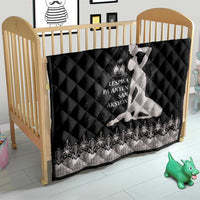 Black quilted crib blanket with silver border and dancer silhouette artwork