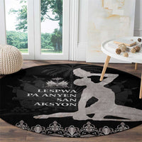 Round area rug in black with gray map silhouette, central text, and floral damask trim