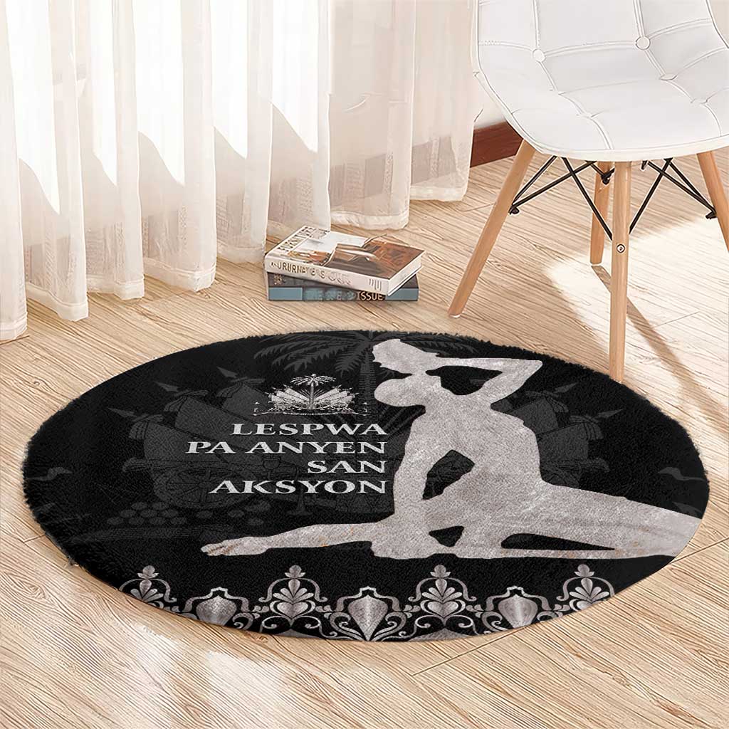 Round area rug with black base, gray island graphic, and ornate damask border at edge