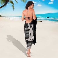 Black sarong with gray dancer print and ornate hem border, rear view