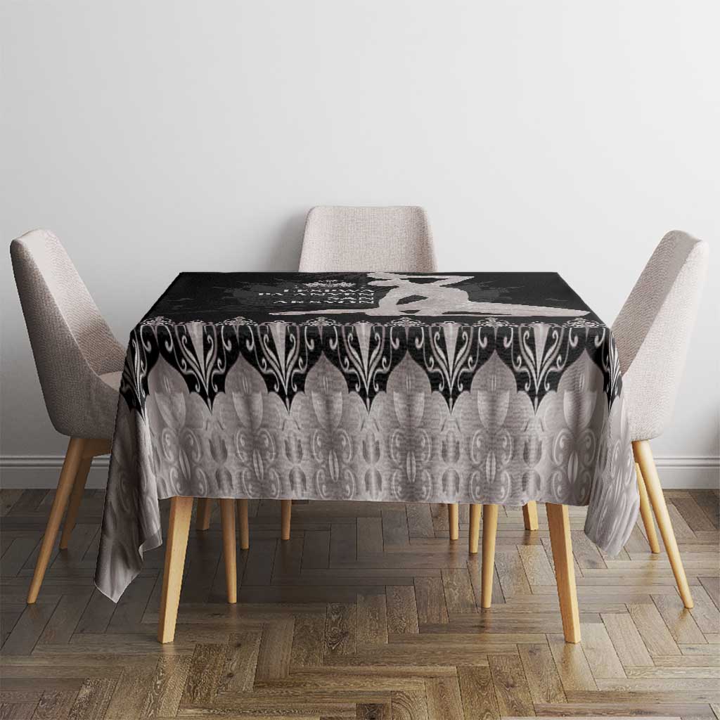 Silver tablecloth with black damask-style scroll pattern across tabletop