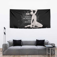 Black tapestry with seated woman motif and silver decorative border across the bottom