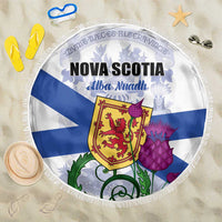 Round beach blanket with Nova Scotia flag graphic, fringed edge, blue and white