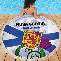 Round beach blanket with Nova Scotia shield and blue stripes, fringed edge