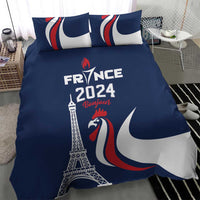 Blue duvet and two pillows with Eiffel Tower, rooster, and France 2024 Bonjour design