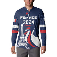 Blue France 2024 button sweatshirt worn by model; front “Bonjour” graphic and flags