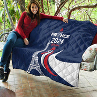 Blue France 2024 quilt blanket with Eiffel Tower, rooster, and crescent moon graphic, draped