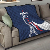 Blue France 2024 quilt blanket on sofa with Eiffel Tower, rooster, and crescent moon print