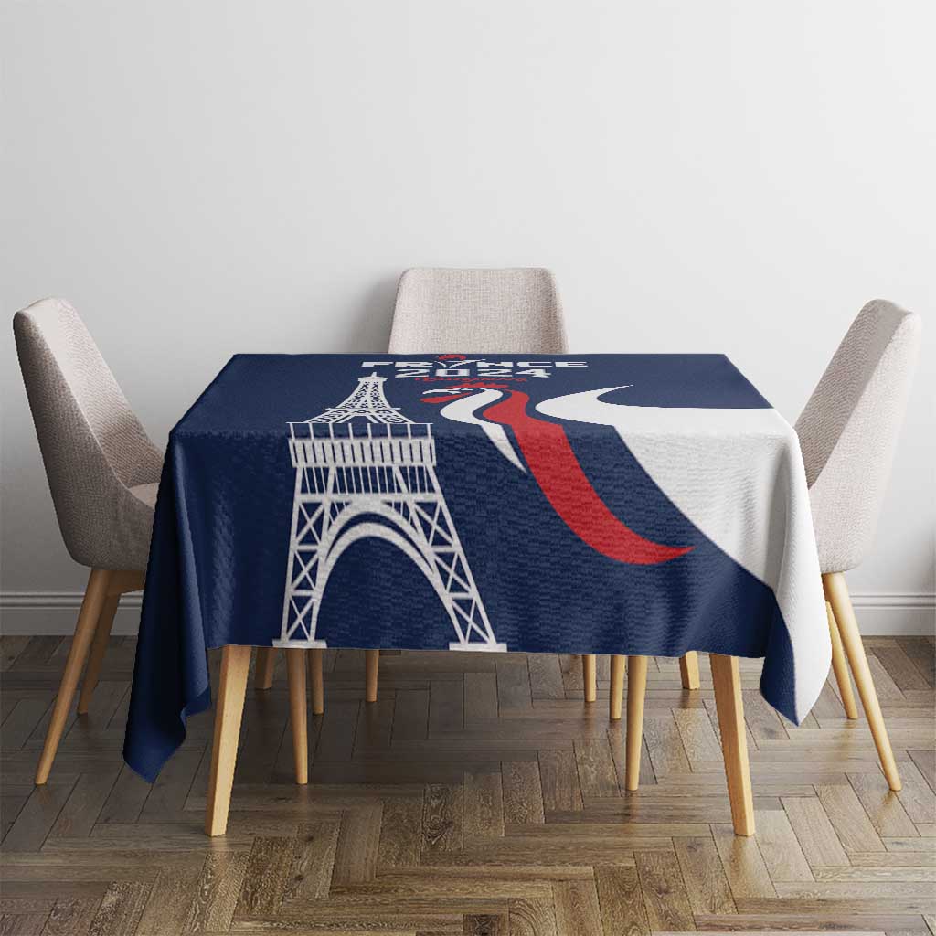 Blue tablecloth with large Eiffel Tower print and red-and-white wave shapes.