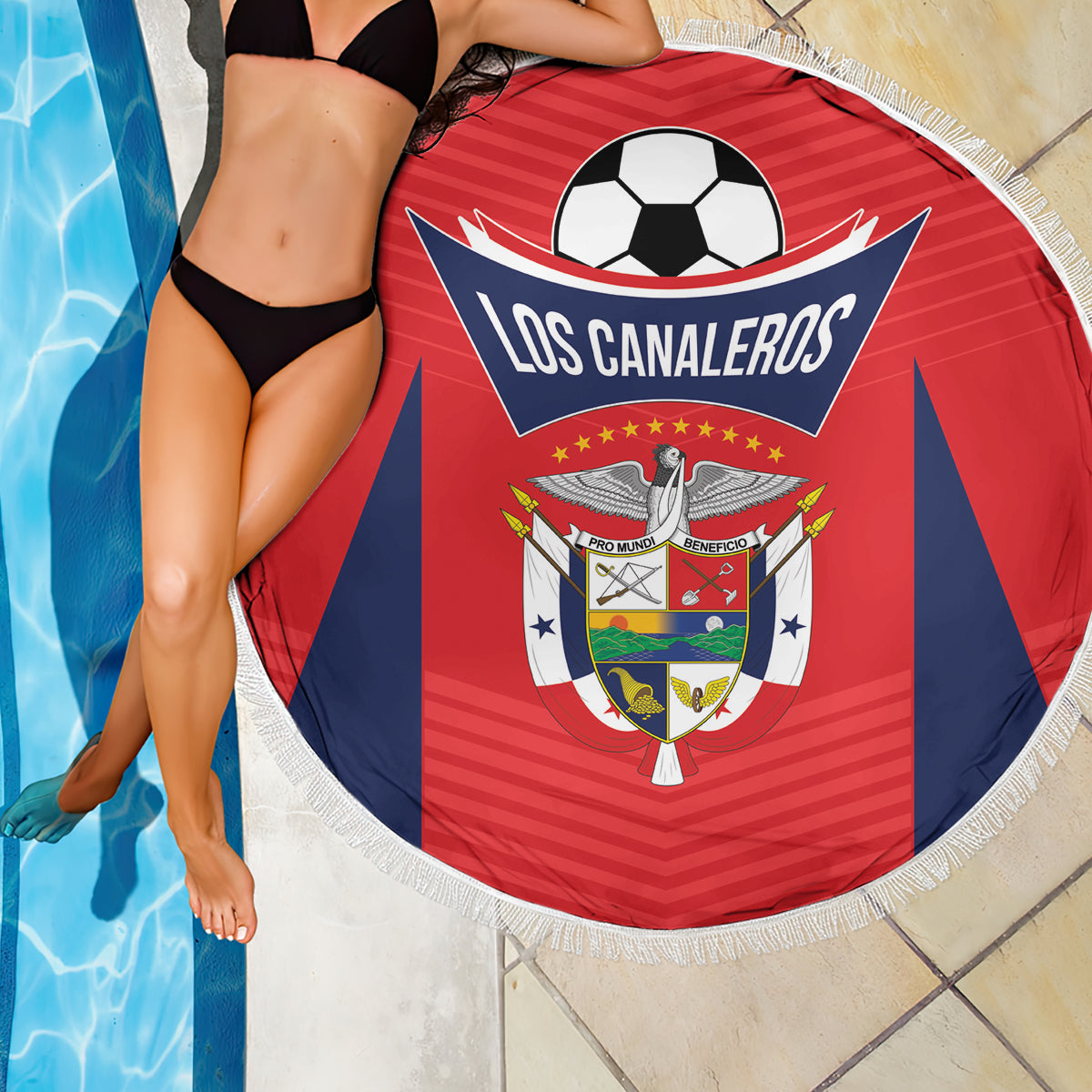 Red round fringe football beach blanket with Los Canaleros logo, partially wrapped